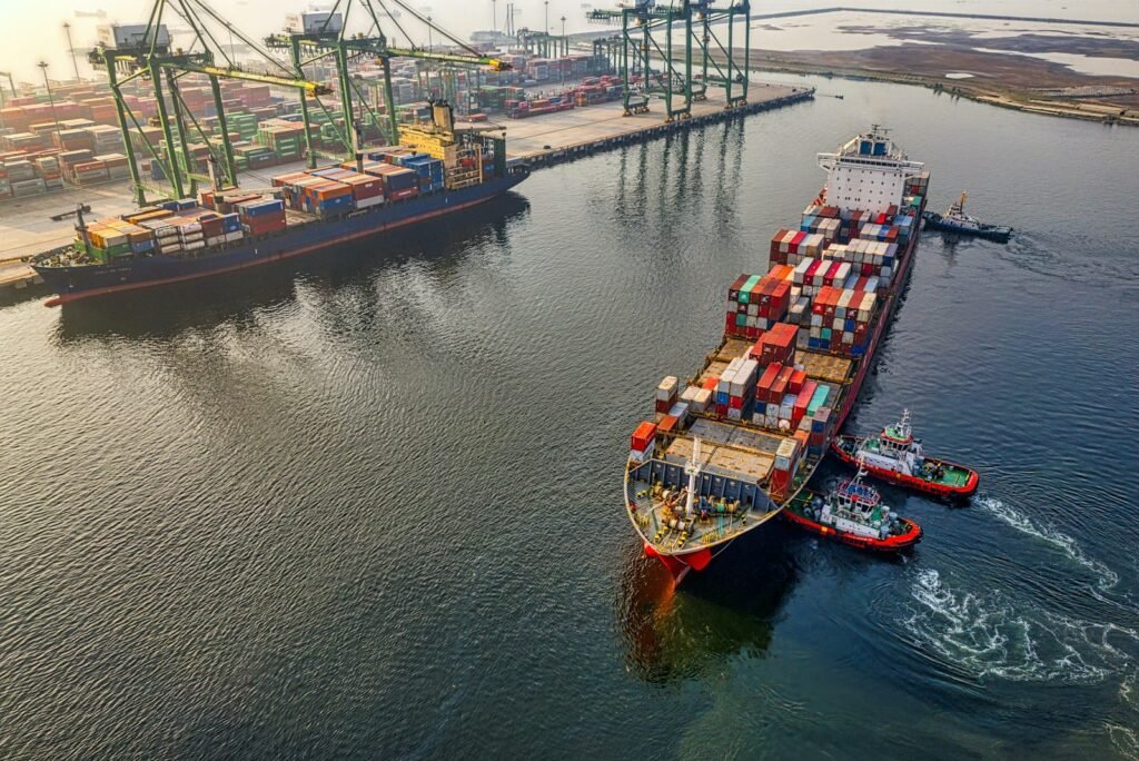 Container ship loaded with cargo departing port for international export