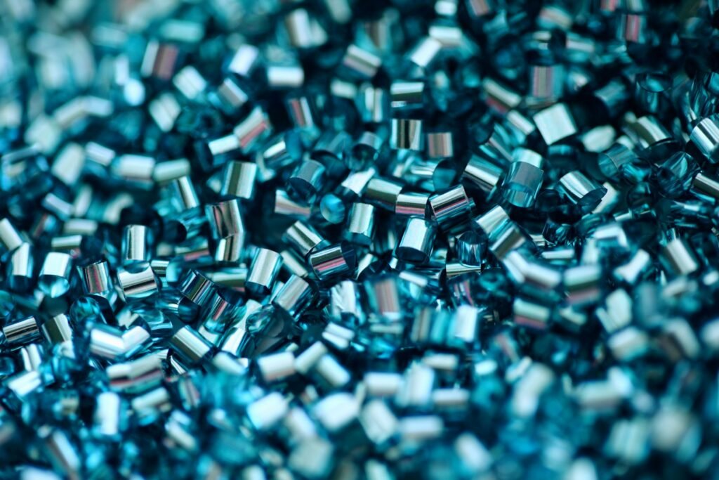 Close-up of coloured polymer granules used in plastics manufacturing